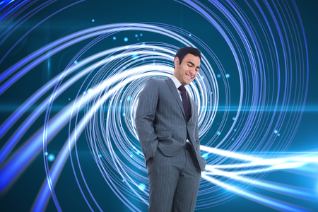 Composite image of smiling businessman standingの写真素材