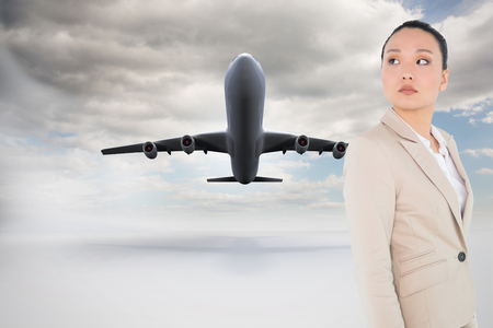 Composite image of unsmiling asian businesswoman の写真素材