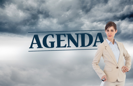 Composite image of businesswoman with suitcaseの写真素材