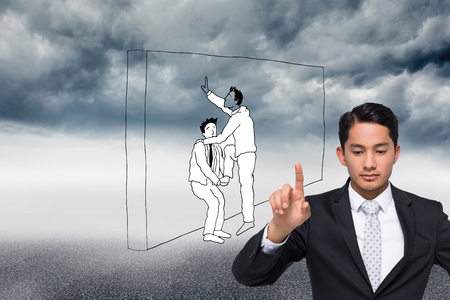 Composite image of unsmiling asian businessman pointingの写真素材