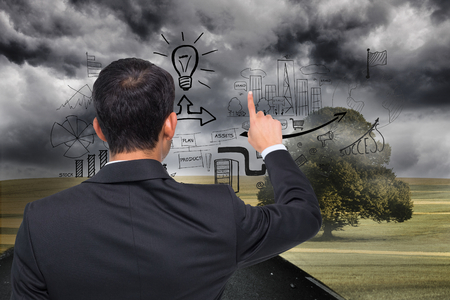 Composite image of asian businessman pointingの写真素材