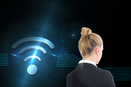 Composite image of blonde businesswoman holding tabletの写真素材