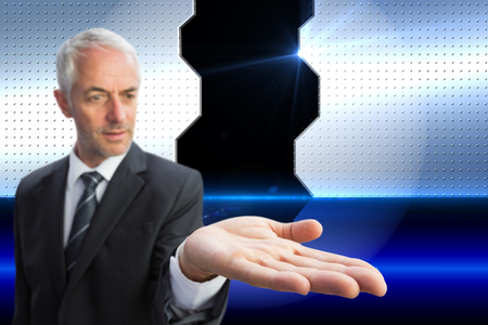 Composite image of concentrated businessman with palm upの写真素材