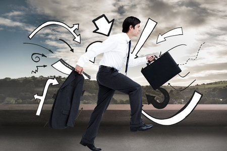 Composite image of side view of walking tradesman with jacket and suitcaseの写真素材