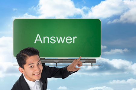 Composite image of smiling asian businessman pointingの写真素材