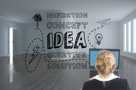 Composite image of blonde businesswoman using laptopの写真素材