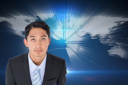 Composite image of serious asian businessman の写真素材