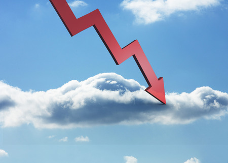 Red arrow pointing down against skyの写真素材