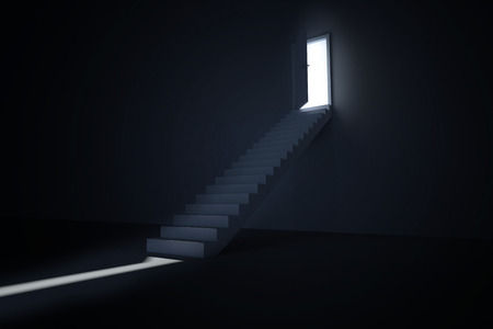 Door opening revealing light at top of stepsの写真素材