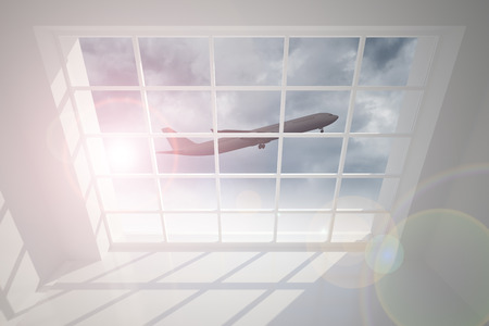 Airplane flying past windowの写真素材