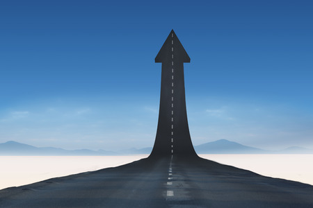 Road turning into arrowの写真素材