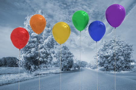 Balloons above a roadの写真素材