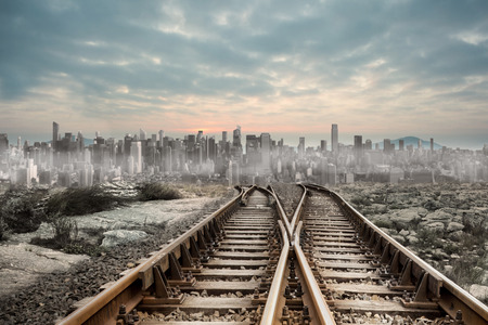 Railway tracks leading to big city