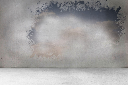 Splash on wall revealing bright skyの写真素材