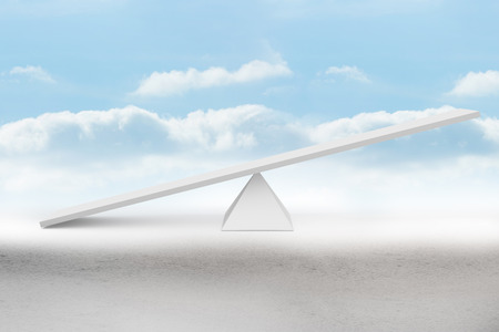 White scales in front of cloudsの写真素材