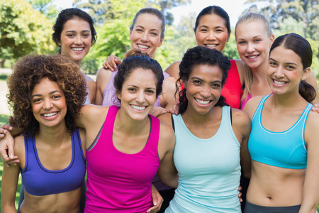Portrait of happy sporty women at park の写真素材