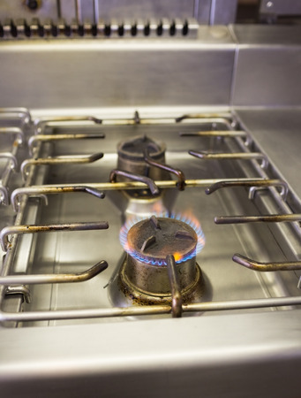 Closeup of burning gas on the kitchen gas stoveの写真素材