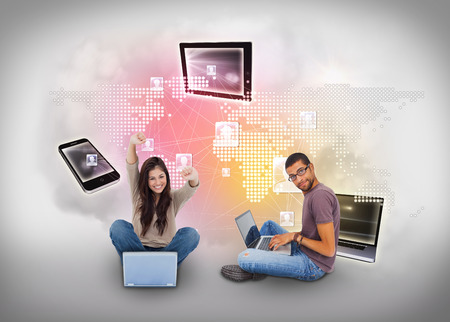 Digital composite of young people using laptops with profiles and mapの写真素材