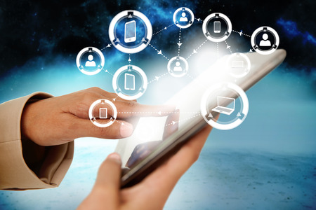 Digital composite of businesswoman touching tablet with interface