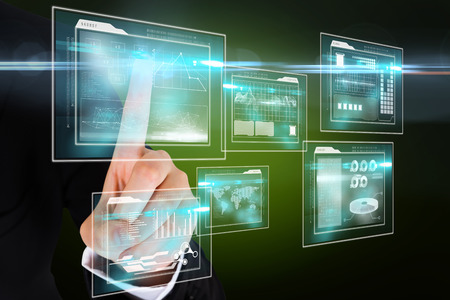 Digital composite of finger pointing to business interfaces