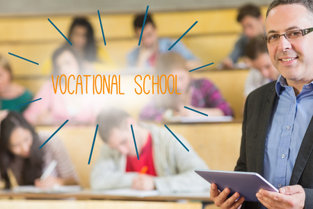 The word vocational school against lecturer standing in front of his class in lecture hallの写真素材