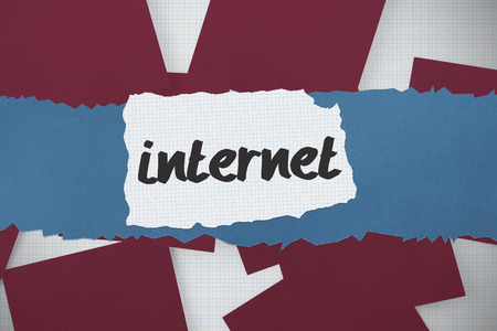 The word internet against wine paper strewn over gridの写真素材