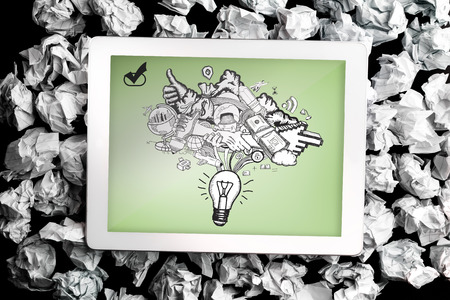 Ideas doodle on digital tablet on crumpled paperの写真素材