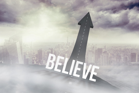 The word believe against road turning into arrow