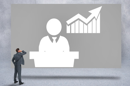 Composite image of thinking businessman against grey card