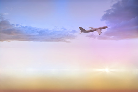Graphic airplane flying over beautiful orange and blue sky