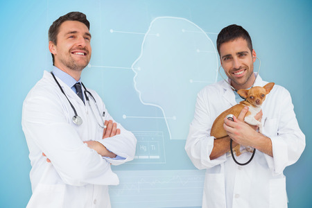Composite image of vet holding chihuahua and doctor against medical interfaceの写真素材