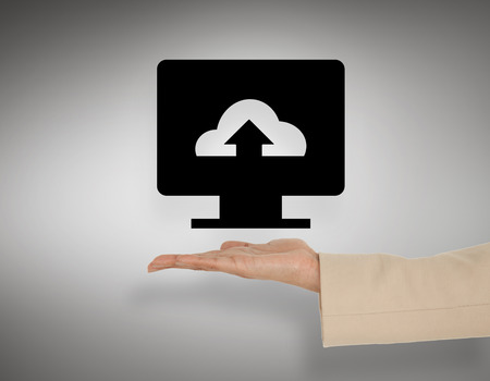 Female hand presenting cloud computing graphic against grey vignetteの写真素材