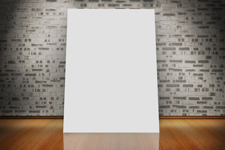 White card against room with brick wallの写真素材