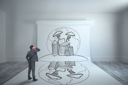 Thinking businessman against large white screen showing doodleの写真素材