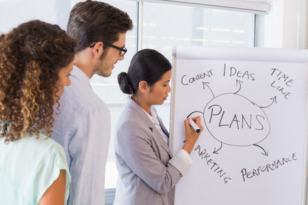 Casual businesswoman giving a presentation in the officeの写真素材