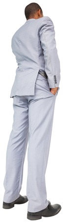 Thinking young businessman in blue suit on white backgroundの写真素材