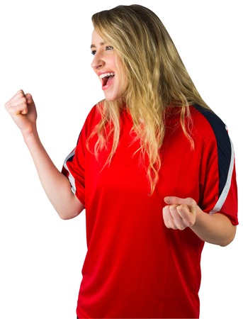 Cheering football fan in red on white backgroundの写真素材