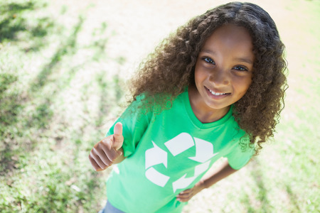Young environmental activist smiling at the camera on a sunny dayの写真素材
