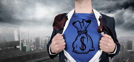 Businessman opening his shirt superhero style against balcony overlooking cityの写真素材