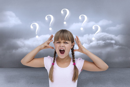 Crazy little girl against clouds in a room with question marksの写真素材