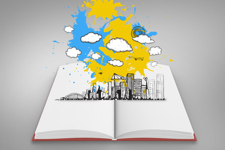 Composite image of cityscape graphic on paint splashes on open book against grey vignetteの写真素材