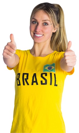 Pretty football fan in brasil t-shirt on white backgroundの写真素材