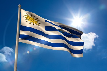 Uruguay national flag on blue sky backgroundの写真素材