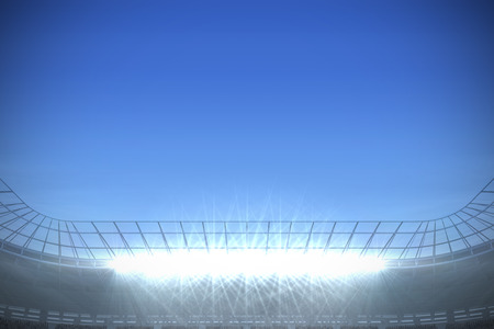 Digitally generated large football stadium under bright blue skyの写真素材