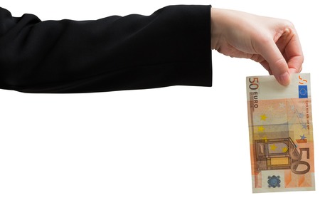 Businesswomans hand holding fifty euro on white backgroundの写真素材