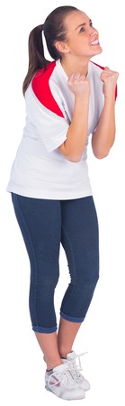 Excited football fan in white cheering on white background
