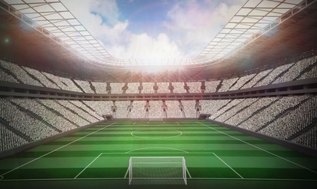 Football stadium with fans in white under sunny skyの写真素材