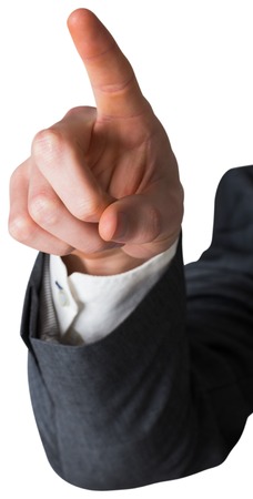 Businessman in grey suit pointing on white backgroundの写真素材