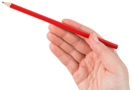 Hand holding red pencil on white backgroundの写真素材