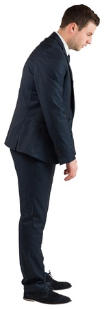 Businessman standing and bowing on white background
